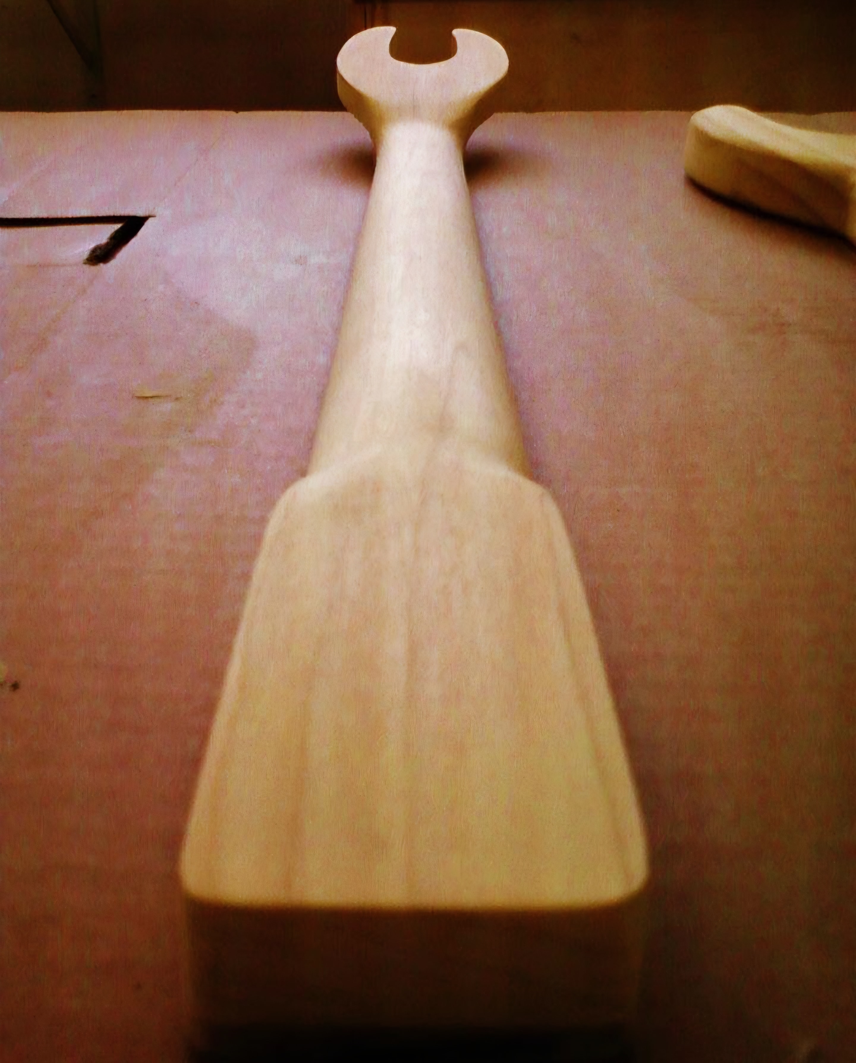 Carved guitar neck.